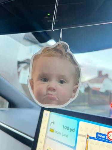 Customer photo: baby face photo air freshener in a car