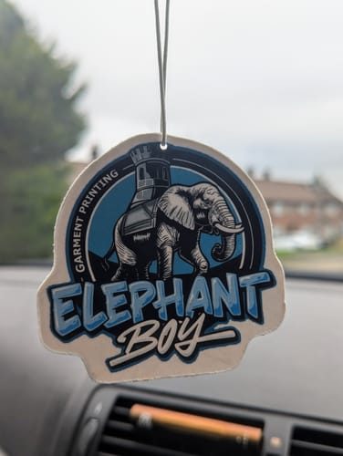 Customer photo: brand logo merch air freshener on a rearview mirror